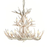 White faux antler chandelier on a white background