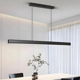 Minimalist black linear pendant light for a dining room