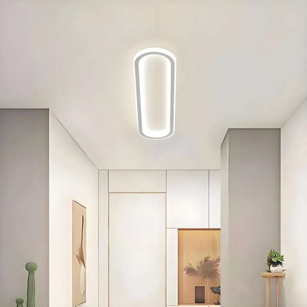 White minimalist oval ceiling light for bedroom or hallway
