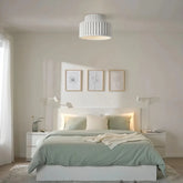 Cream ribbed flush ceiling light installed in a modern bedroom