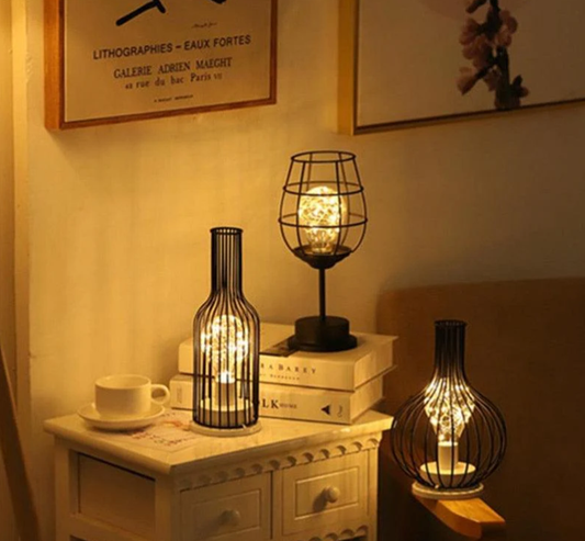 Three metal cage-style table lamps emitting warm yellow light, creating a cozy and relaxing atmosphere for bedrooms, living rooms, or studies.