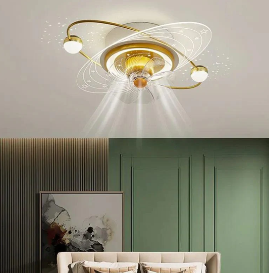 Modern gold ceiling fan with integrated LED light, artistic swirl lighting effect, and elegant living room interior design with green walls and sofa.