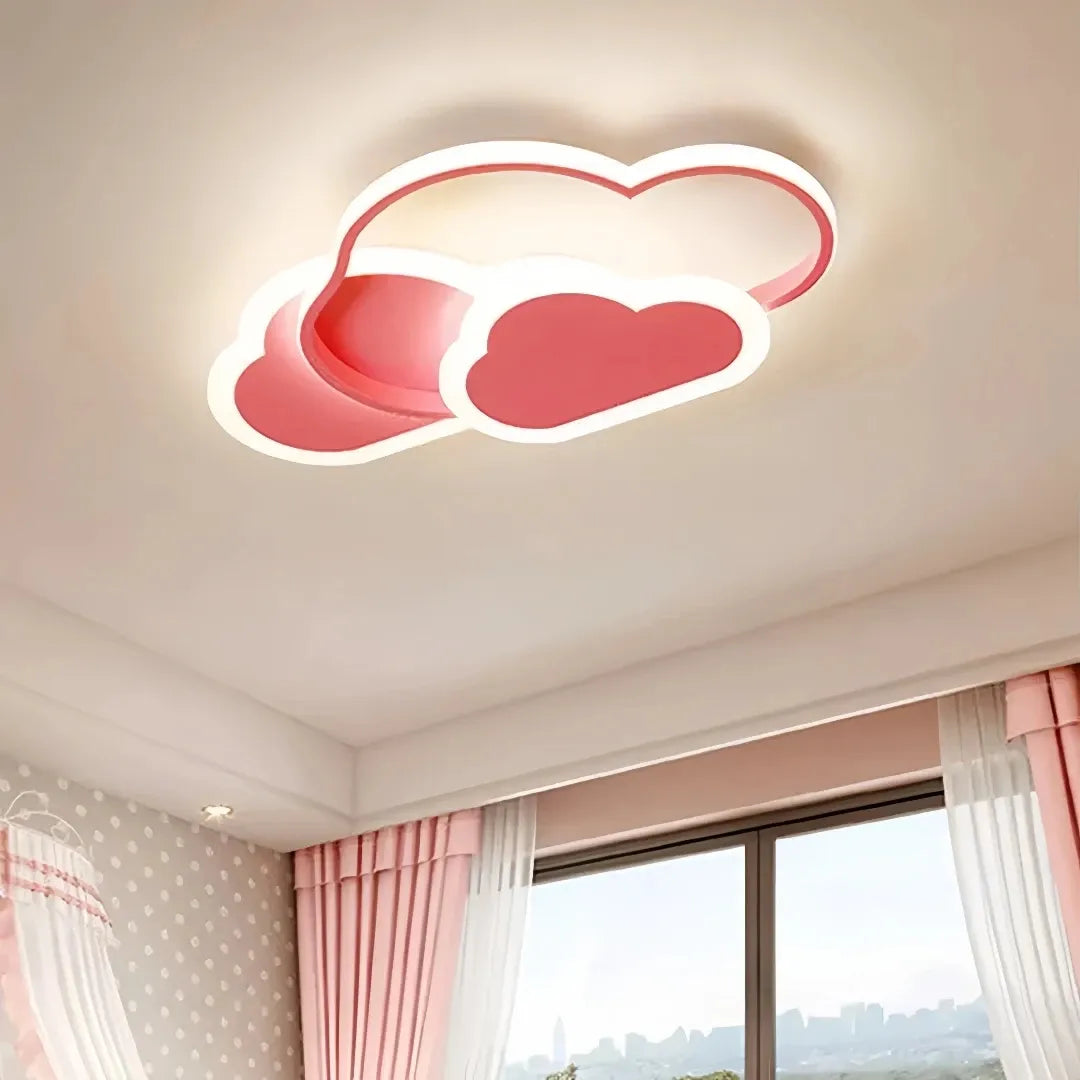 Cloud-shaped LED ceiling light switched on in a child’s bedroom