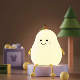 Pear-shaped silicone LED night light glowing warm white