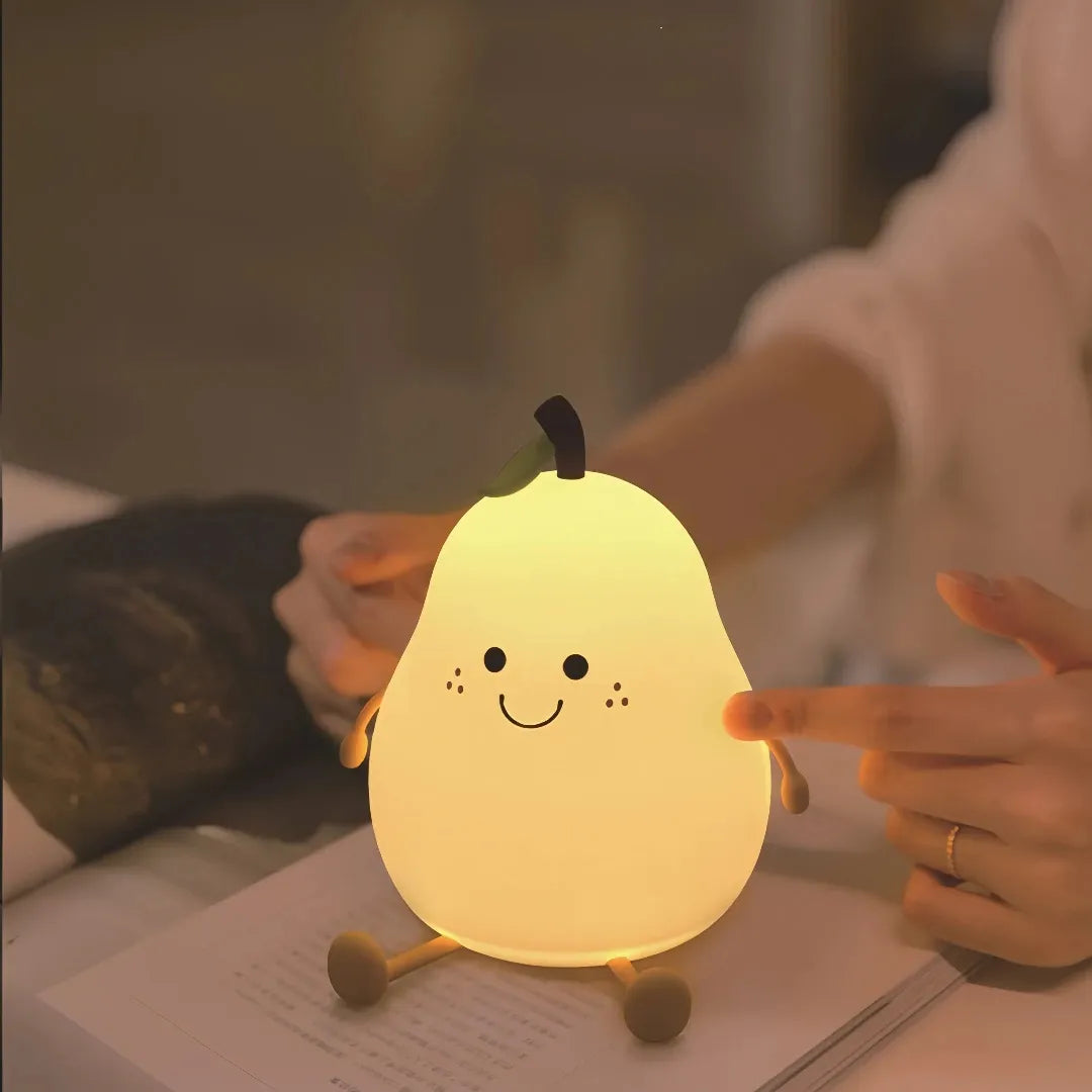 Pear-shaped silicone LED night light glowing warm white 