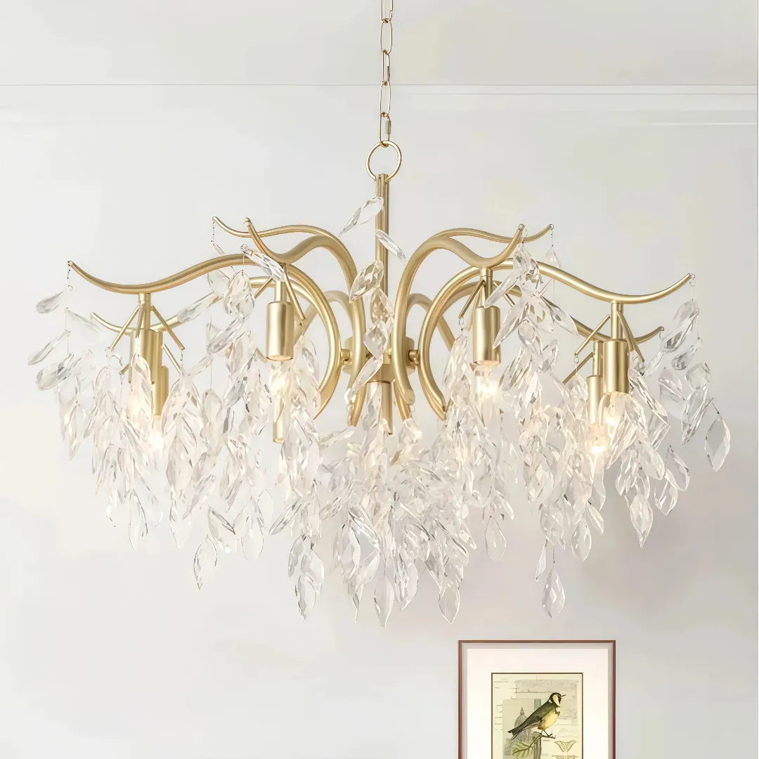 Gold crystal leaf chandelier above a dining table  