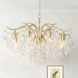 Gold crystal leaf chandelier above a dining table  