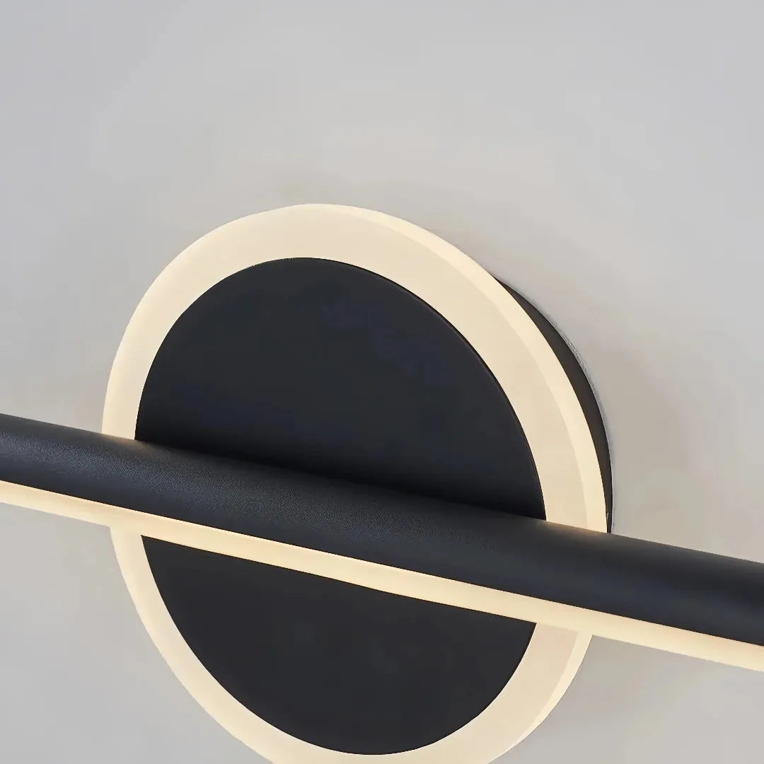 Close-up of the metal body and silicone diffuser on the bathroom mirror light