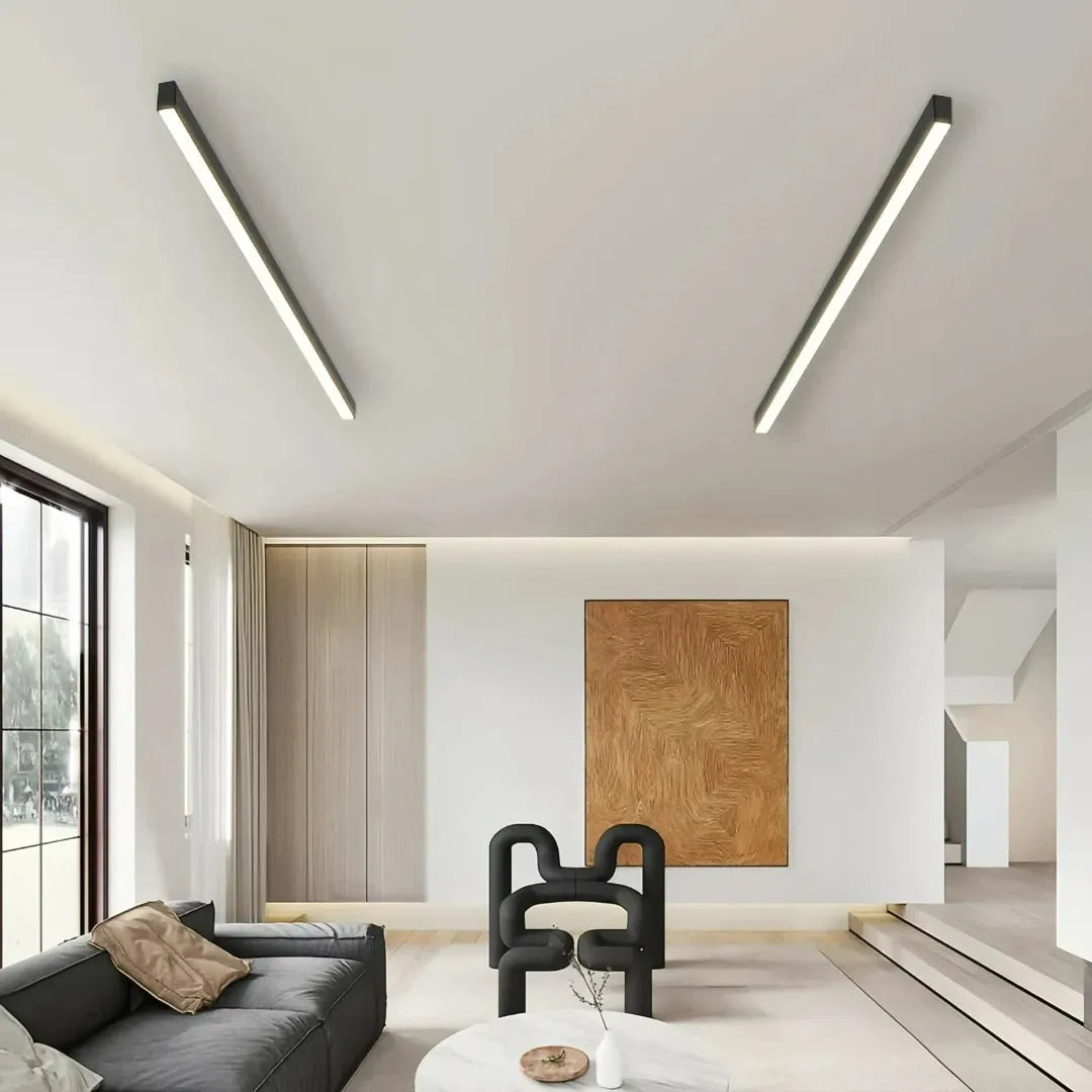 Black linear flush ceiling light installed in a modern living room   