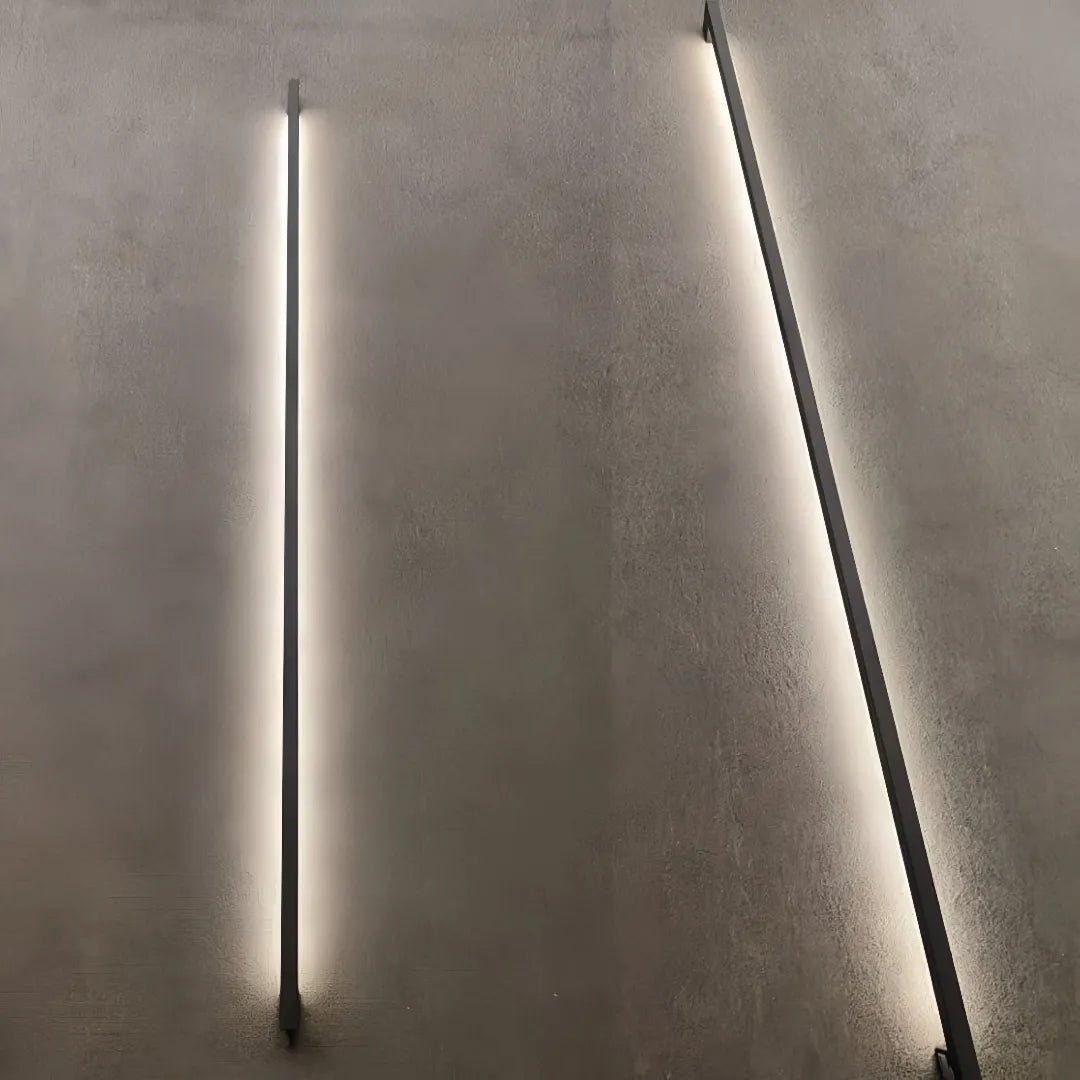Hardwired installation detail for a black indoor LED wall light