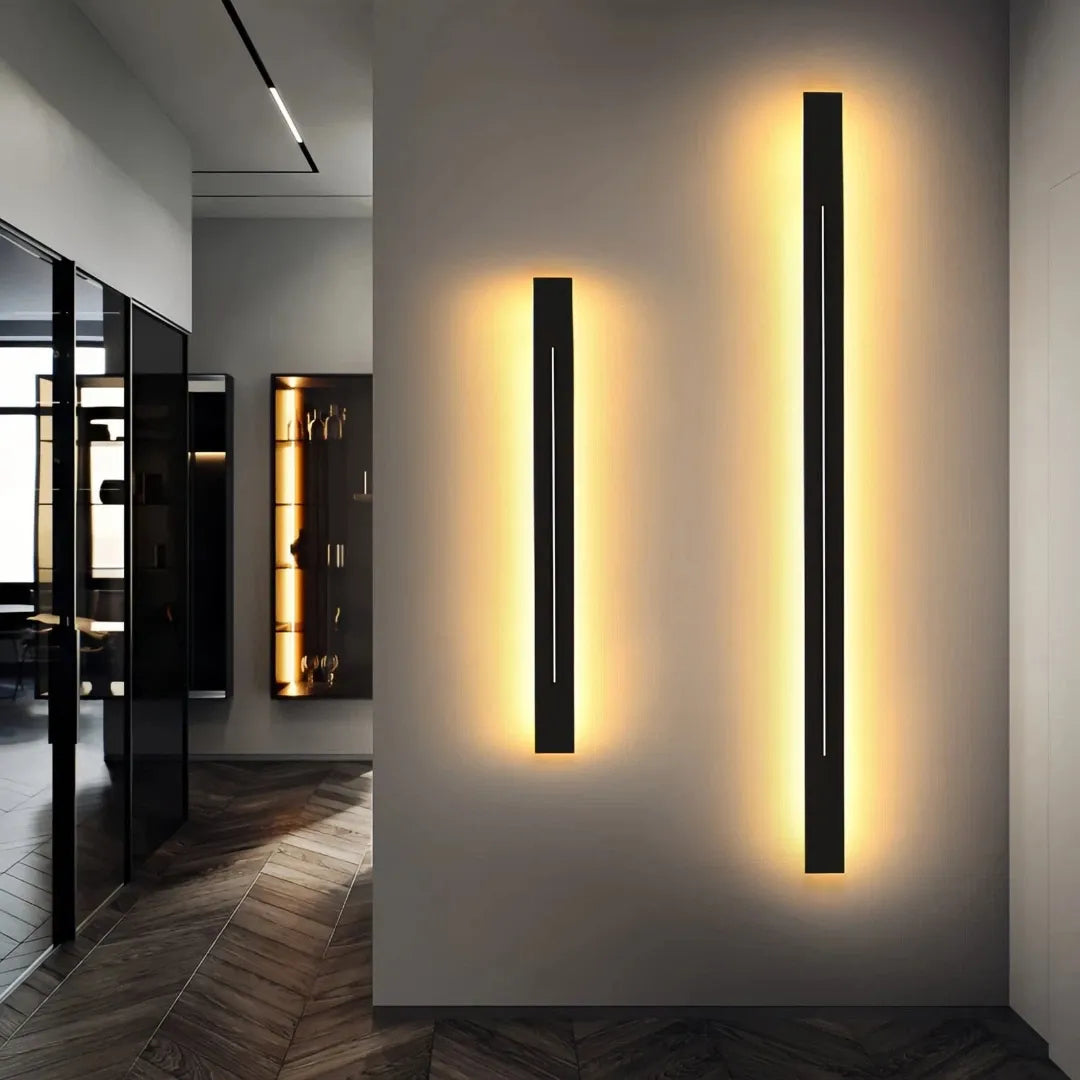 Black linear wall light shown in a modern room setting