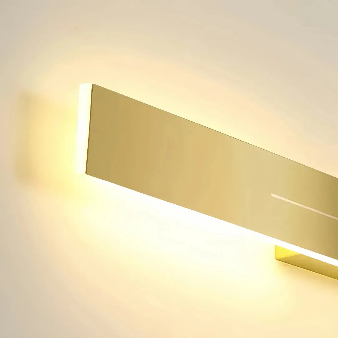 Close-up of the illuminated gold linear wall light