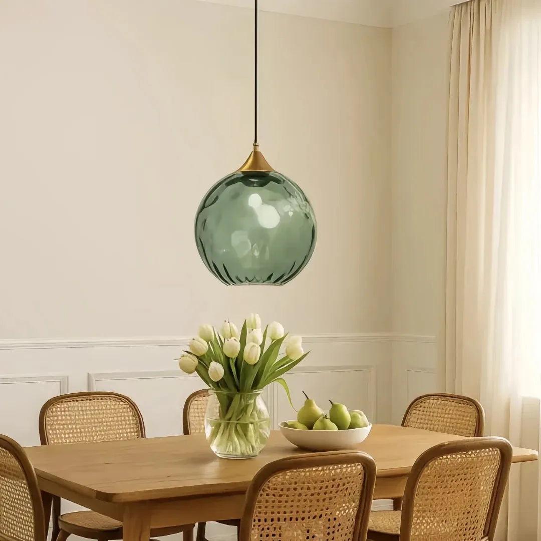 Warm white LED glass pendant light creating cosy dining room ambience
