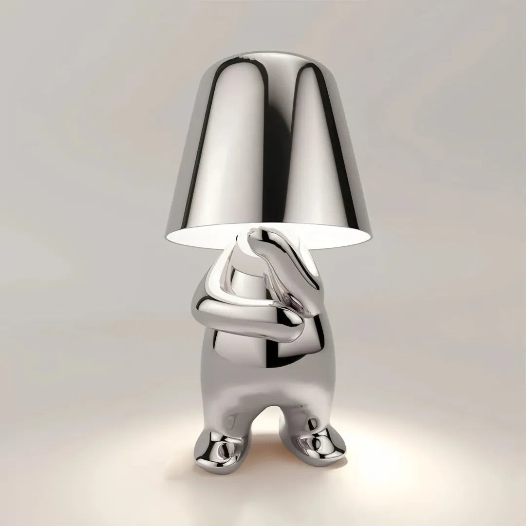 Gold touch bedside table lamp on a bedroom side table