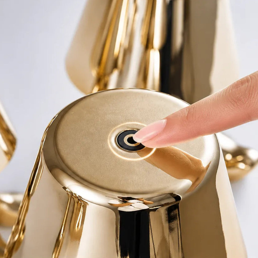 Close-up of the gold figure table lamp and LED light source