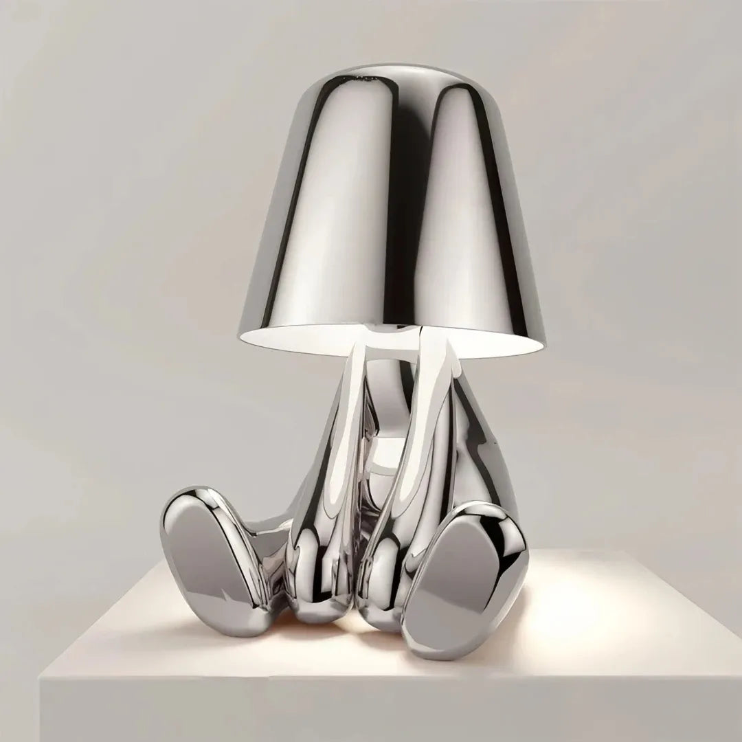 Gold touch bedside table lamp on a bedroom side table