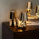 Gold touch bedside table lamp on a bedroom side table