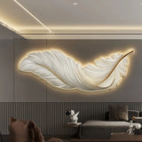 Feather-shaped LED wall light in a living room