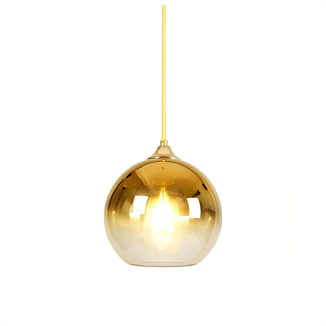 Modern glass globe pendant light in a gold finish