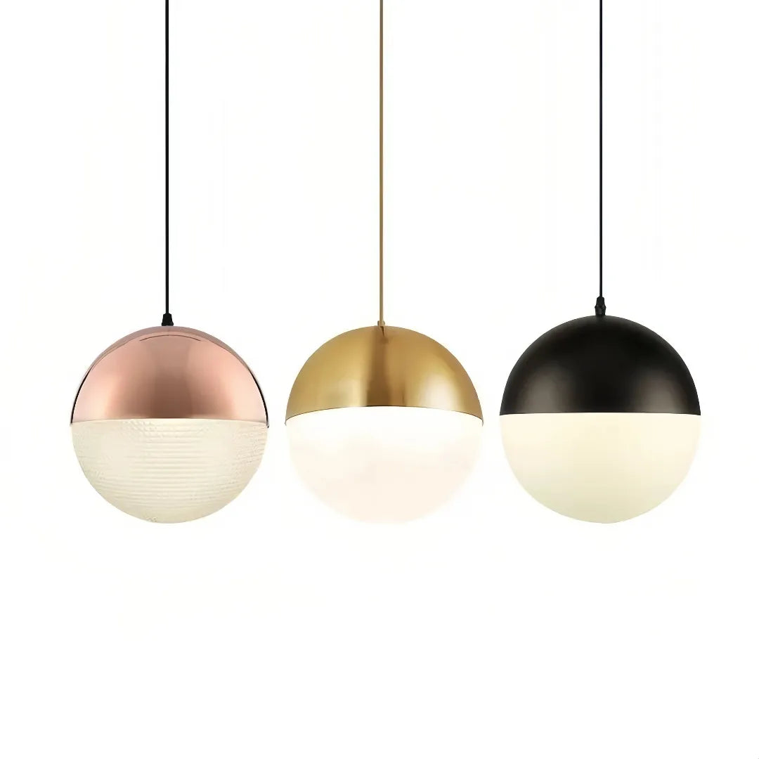 Cluster of glass globe pendant lights above a dining table