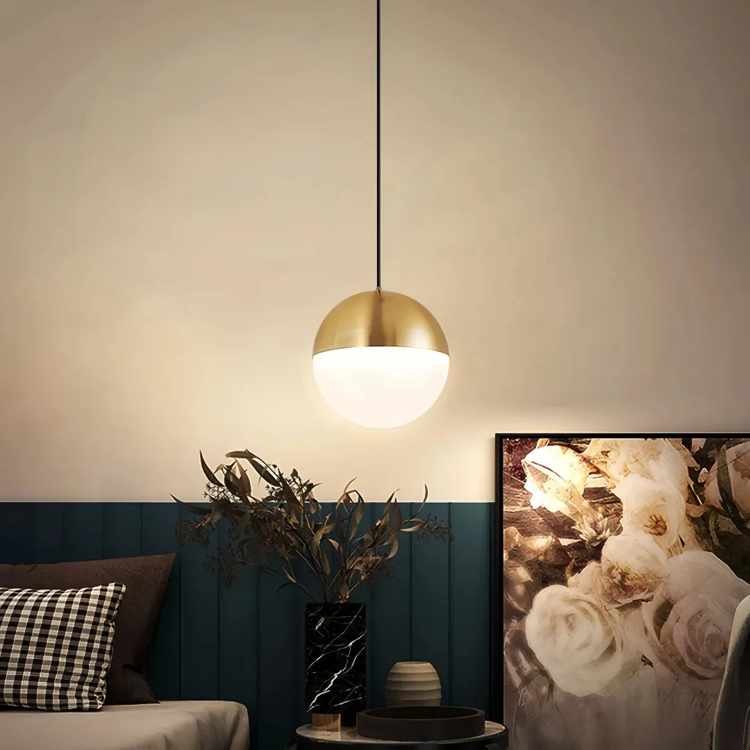 Gold globe pendant light with opal glass shade