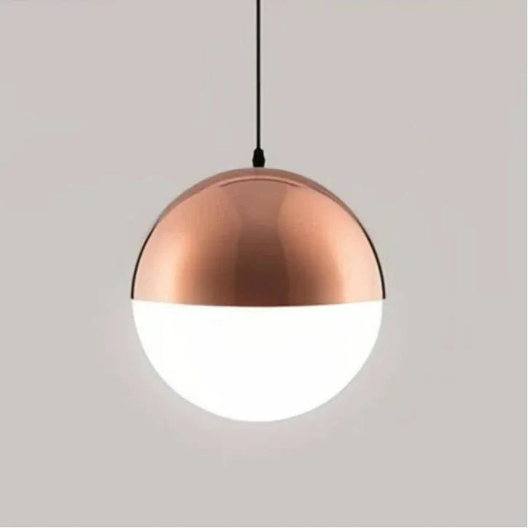 Rose gold pendant light with a frosted glass globe shade 