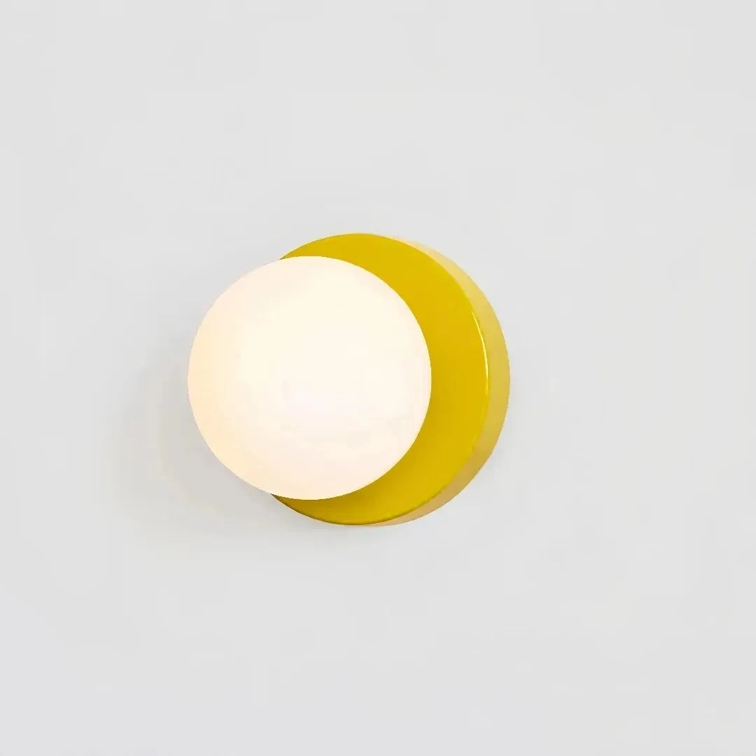Modern glass globe wall light in yellow finish