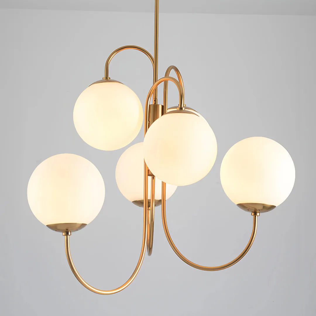 Angled front view showing the chandelier's curved arms and glass globes