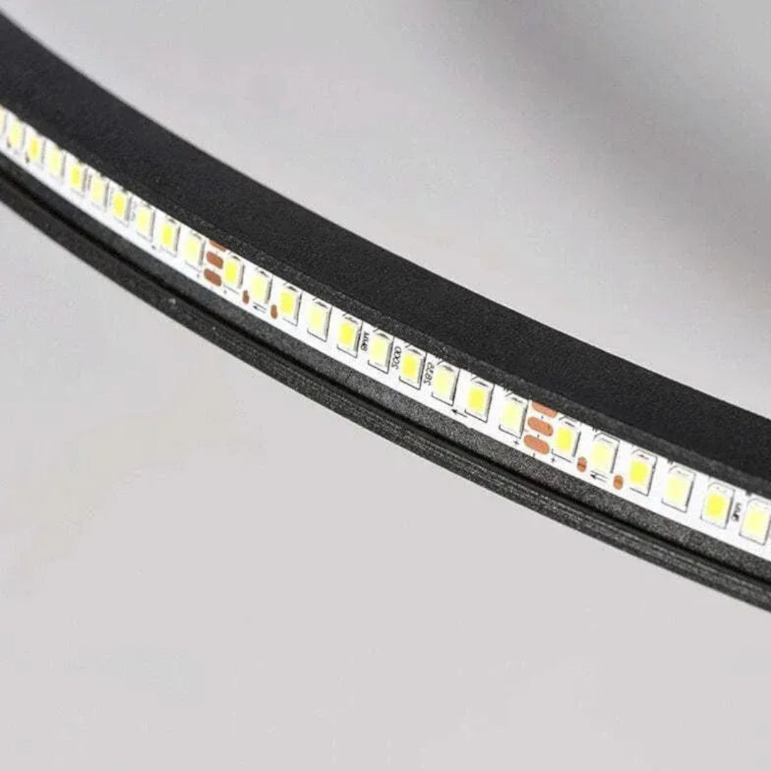 Close-up of the integrated LED strip inside the black ceiling light frame
