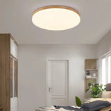 Wooden flush ceiling light showing soft indoor illumination