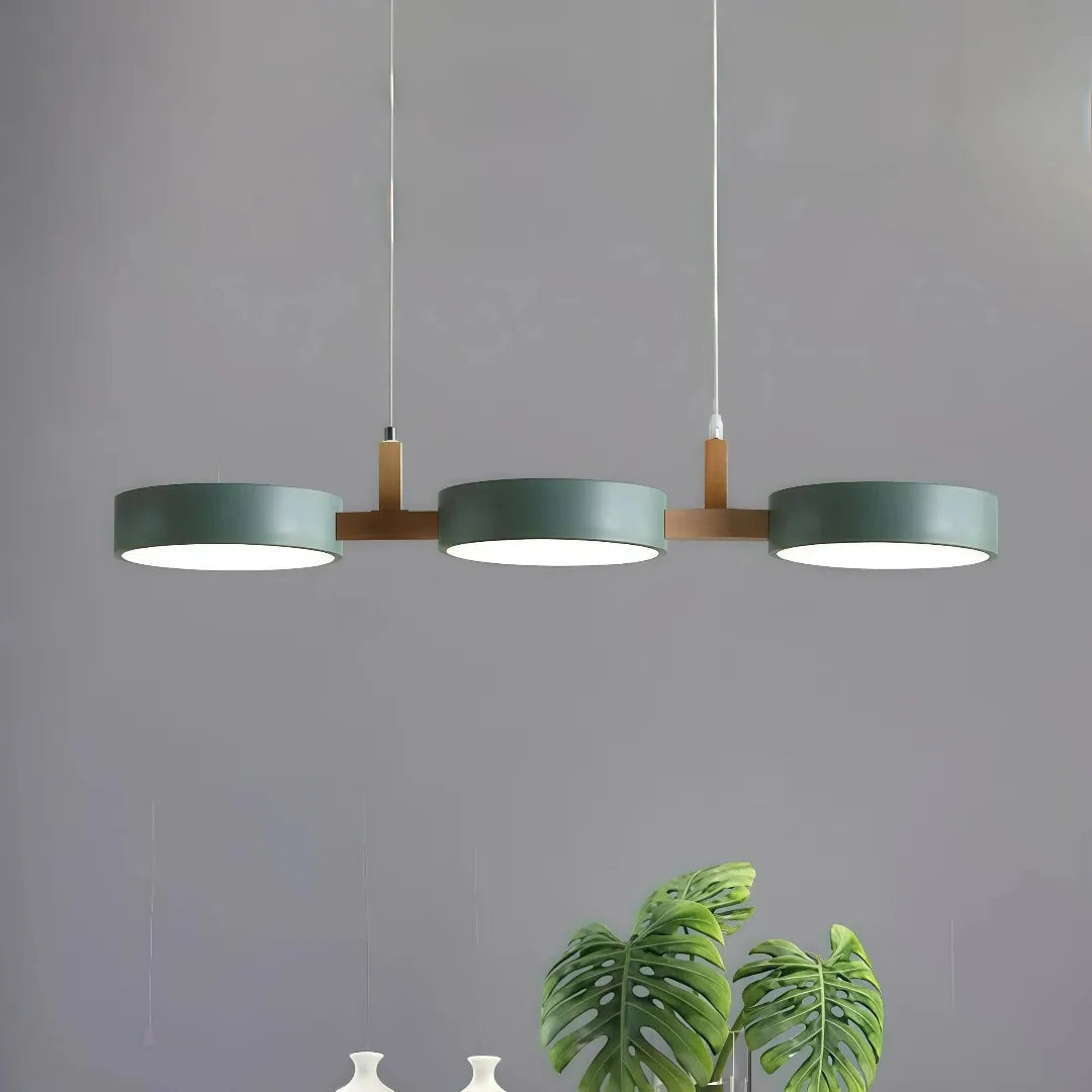 Scandinavian round metal pendant light creating balanced light above a dining table