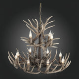 Weathered dark faux antler chandelier on a plain background