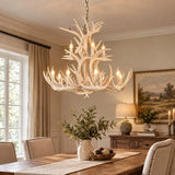 White faux antler chandelier above a dining table