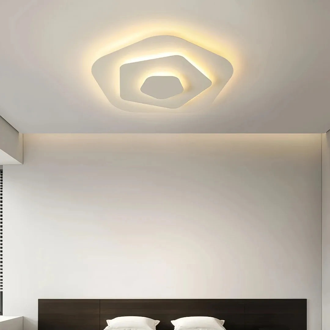 Cream multi-layer LED ceiling light switched on  