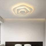 Cream multi-layer LED ceiling light switched on  